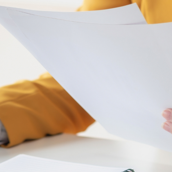 image of profession at a desk reviewing documentation