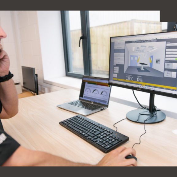 Image of engineer on a call for tech support, at their van with equipment and monitoring electrical equipment 