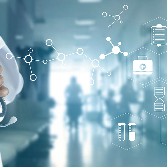 Doctor with hospital background and healthcare icons spread across the background image that is the hospital