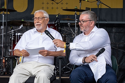 Photo of D. Christian Bender and Steve Mason (CRO) on stage during the Bender Summer Festival