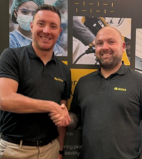 Head of Service Sales shaking hands with new Head of Healthcare Sales 