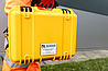 An engineer carrying a portable Tier 1 case 