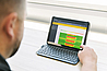Bender engineer reviewing POWERSCOUT remote monitoring software showing a heatmap for energy usage
