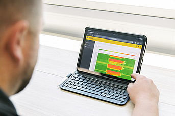 Bender engineer reviewing POWERSCOUT remote monitoring software showing a heatmap for energy usage