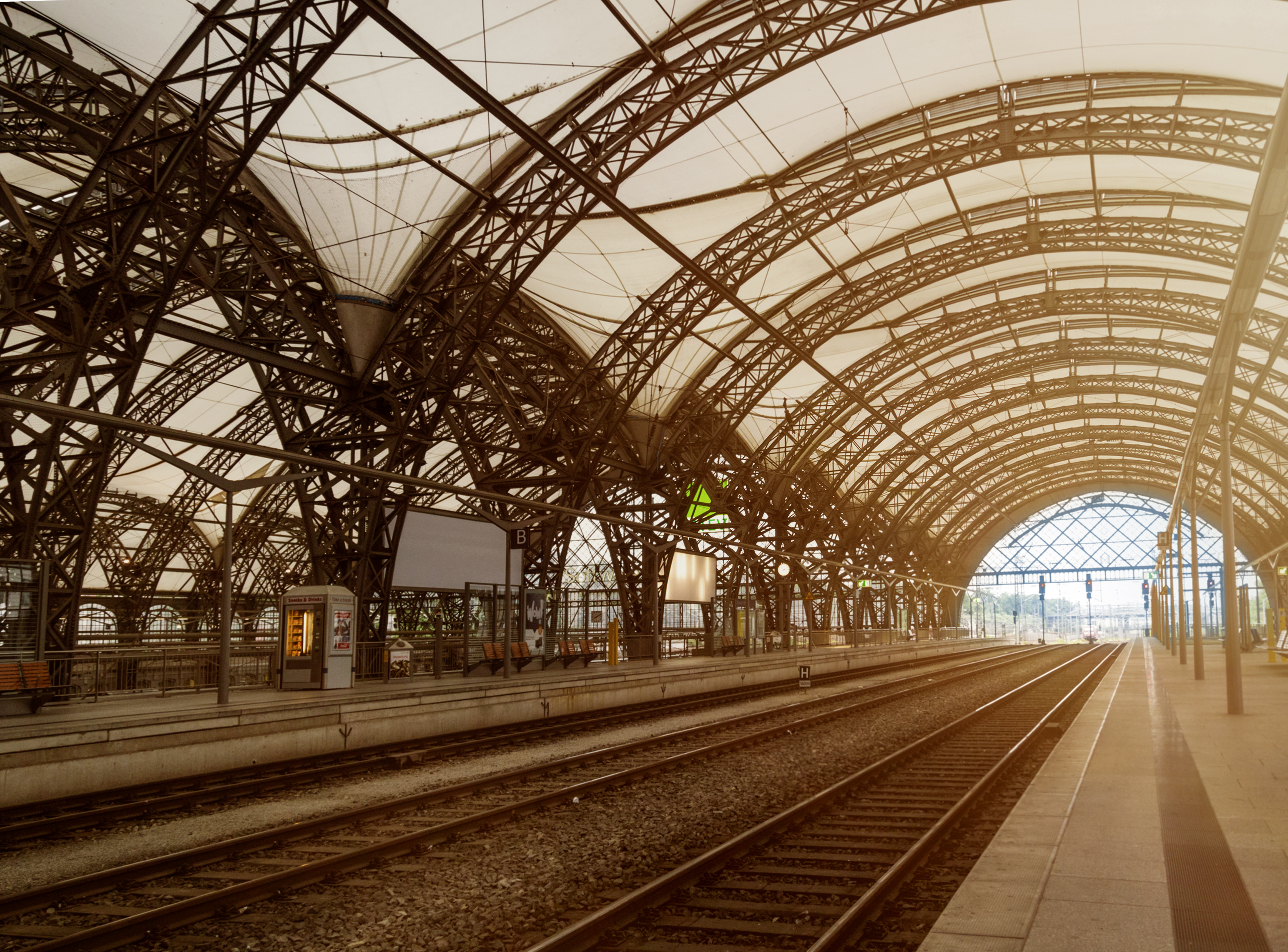 Image of railway building with arched roof design.