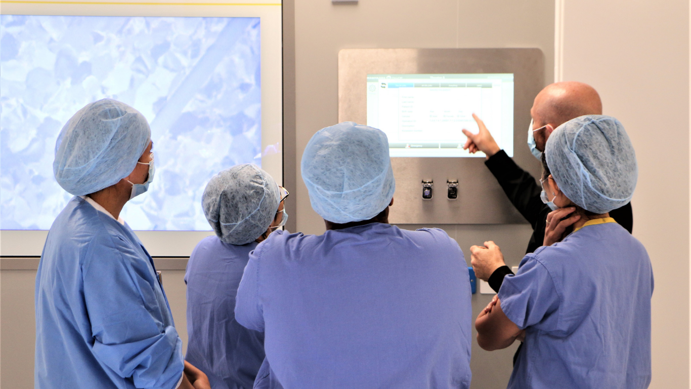 Students in operating theatre learning how to use the equipment
