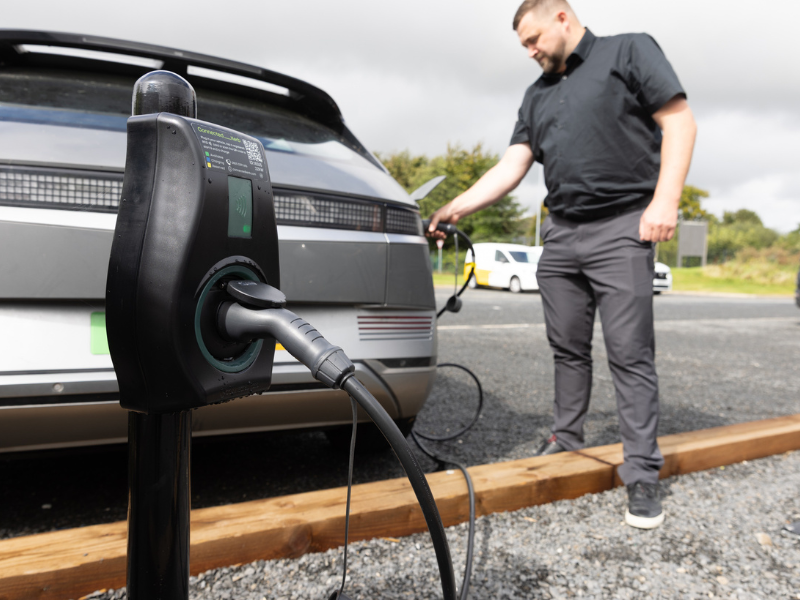 Image of a grey car being charged