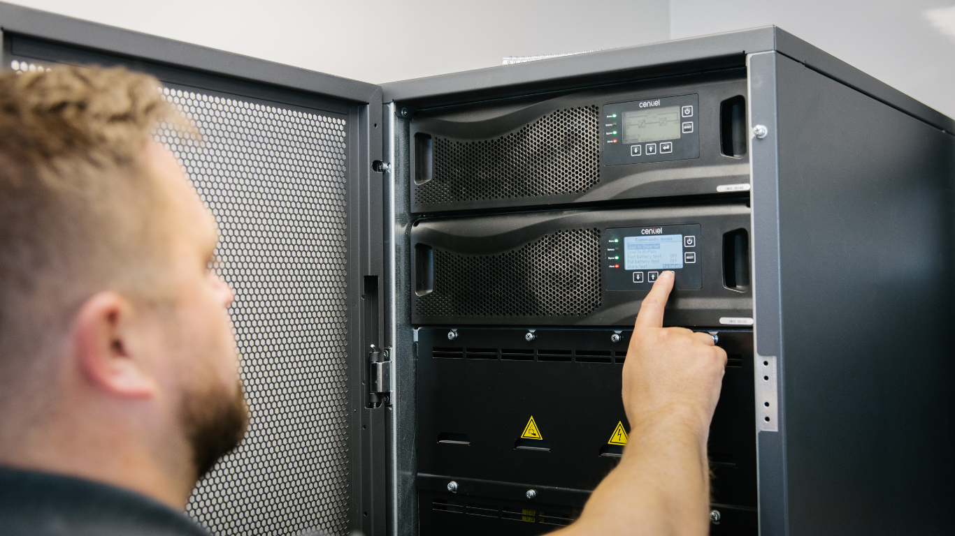 Engineer working on Bender UPS touching the product with his hand
