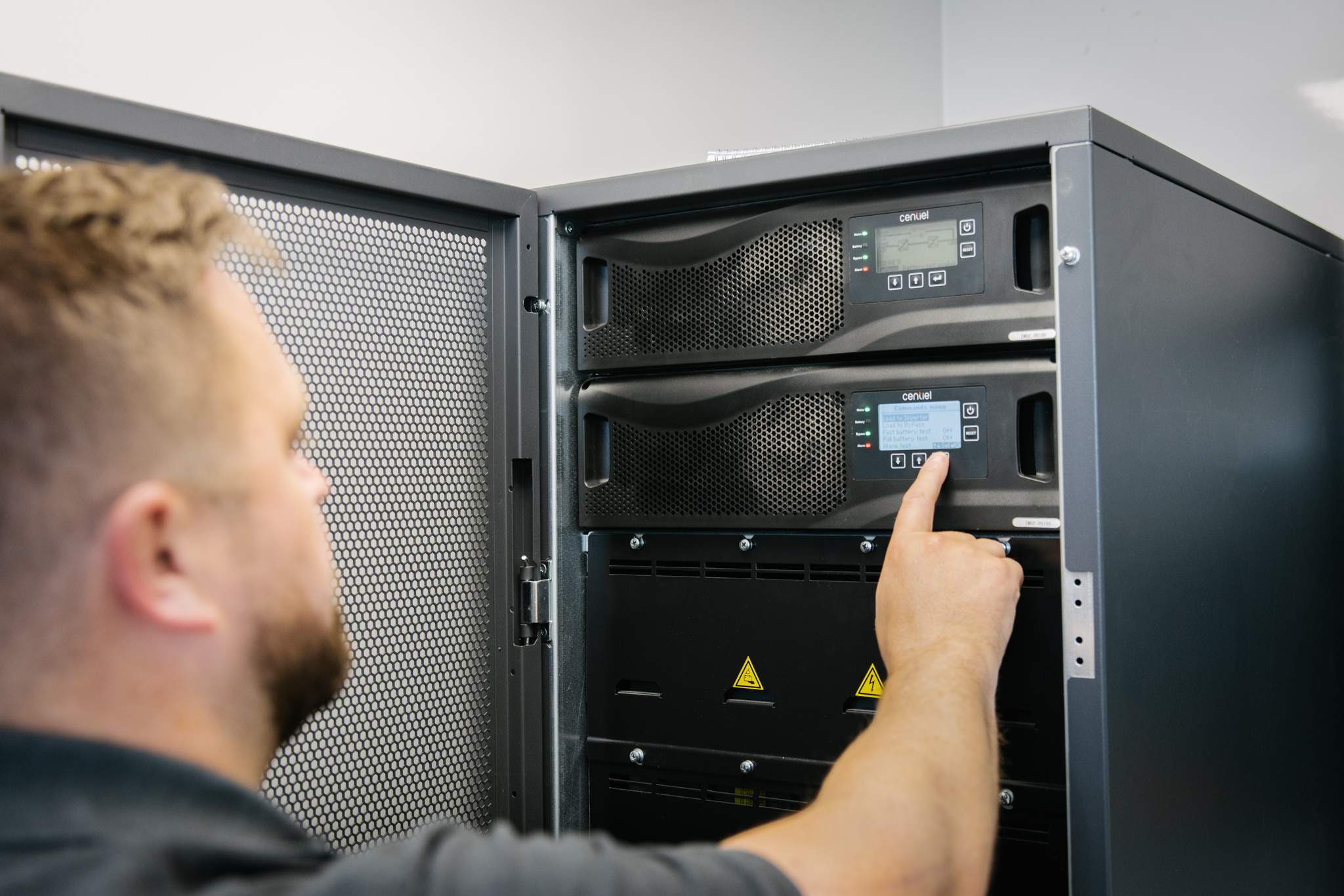 Image of engineer monitoring UPS system in plantroom