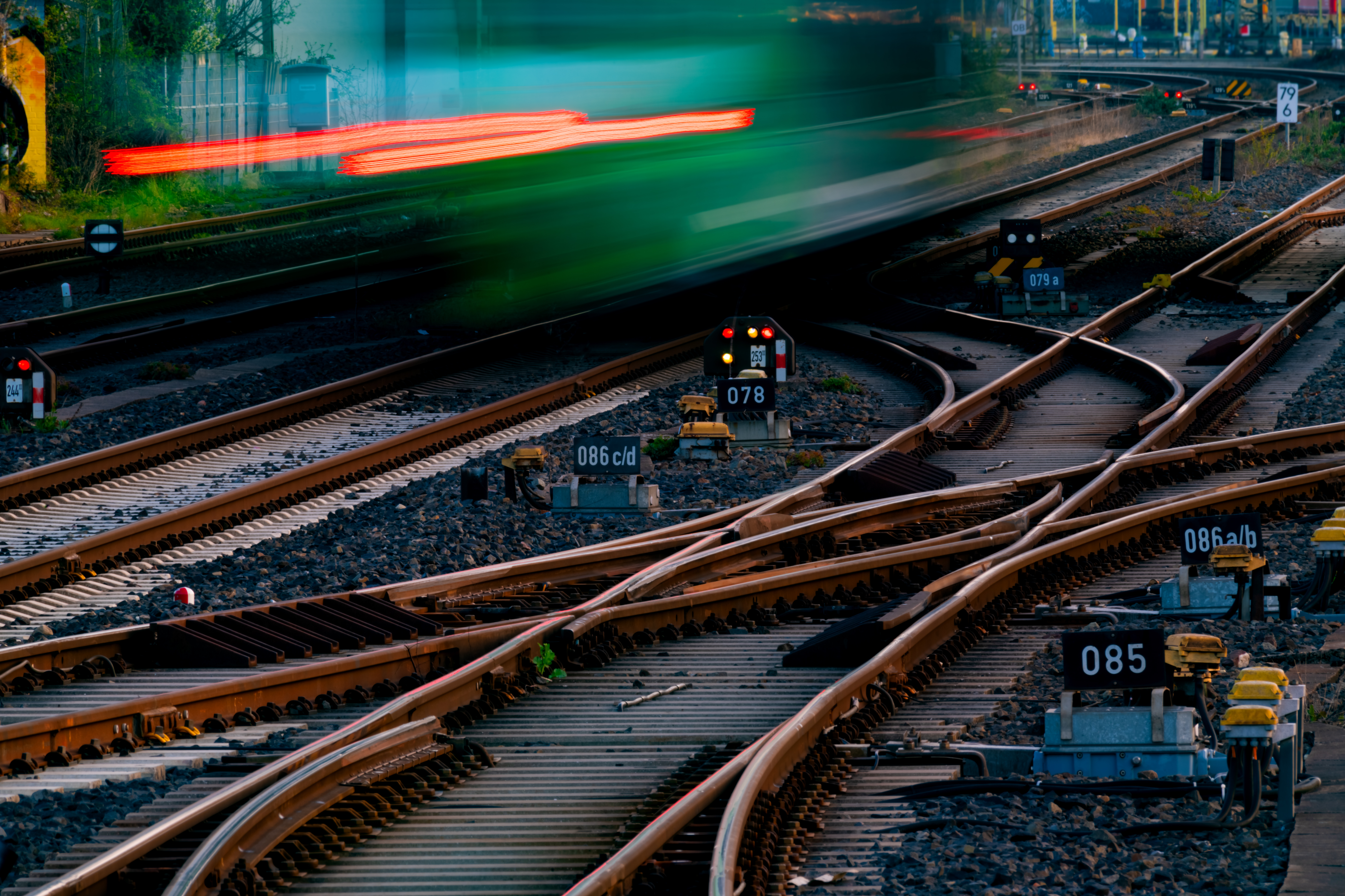 An image of a railway track focusing on the points drive mechanism, which controls the movement of switch rails to guide trains onto different tracks.