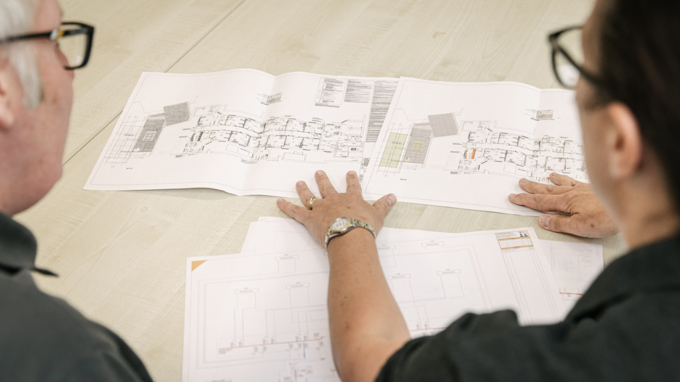 Engineers planning projects at a table 