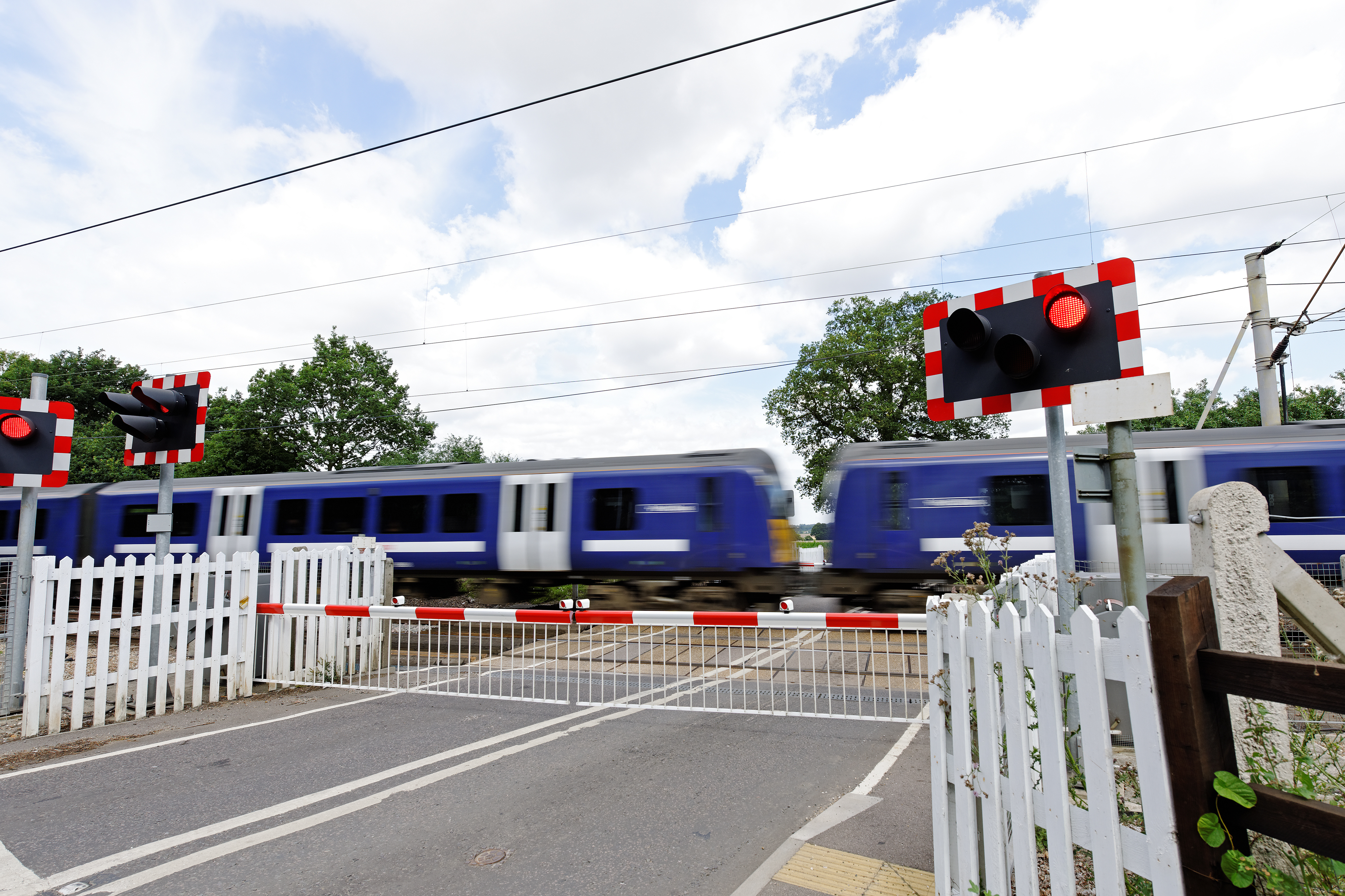 Train at railway crossing.